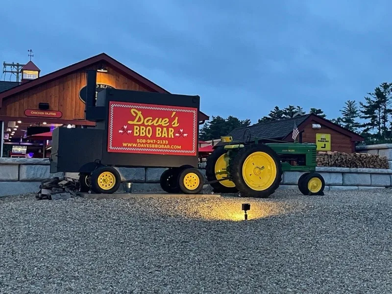 Dave's BBQ Bar smoker and event space at dusk